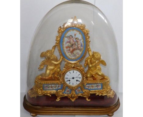 A 19thC French ormolu eight day bell-striking mantel clock by Miroy of Paris, an oval polychrome porcelain plaque painted wit