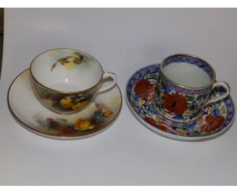 A Royal Worcester cup & saucer painted roses together with a Derby Japan pattern tea cannister & saucer  (4)