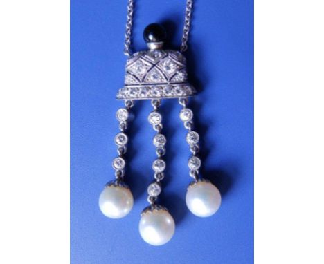 A diamond set platinum pendant necklace, with black onyx finial and three pearl swings, 1.8”
