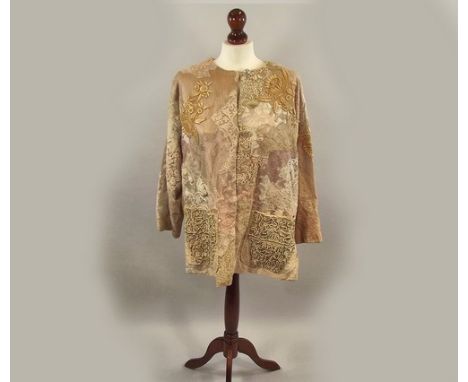 LACE JACKET.
A handmade jacket, the lining of pearl pink satin, the exterior constructed of antique handmade & machine made l