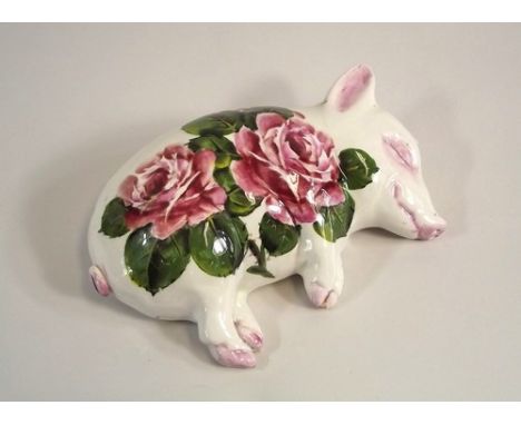 WEMYSS PIG.
An Exon Pottery Wemyss Ware sleeping pig by Brian Adams. The base with stamped & painted Exon & Wemyss Ware marks