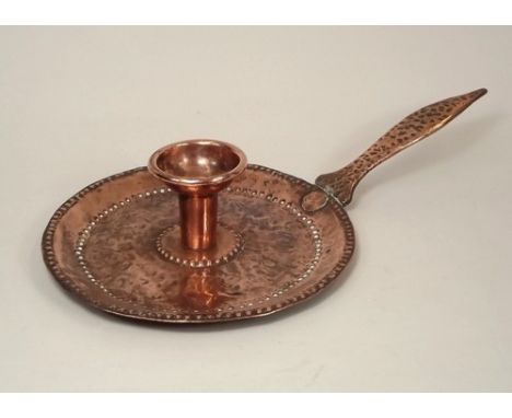 JOHN PEARSON.
A John Pearson chamber stick. 'JP' stamp in oval. Width 32cm., diameter of pan 19cm. 
Note: This is item is not