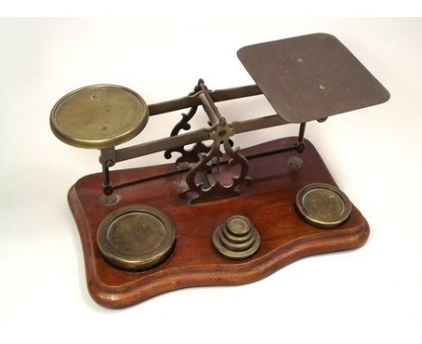 BRASS SCALES.
A set of brass scales with a set of six nesting weights, 1oz-2lbs.
Width 32cm.