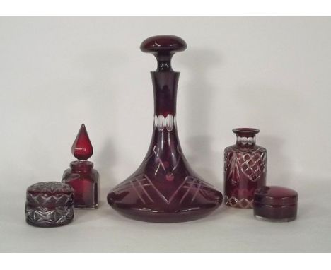 RUBY GLASS.
A cut ruby glass decanter, 29cm & four other pieces of red glass.