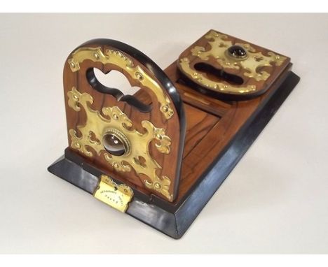 VICTORIAN BOOK TROUGH.
A good quality, Victorian walnut, Betjemann's Patent extending book trough, with brass mounts & cabouc