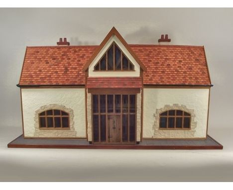 DOLL'S HOUSE.
A hand made doll's house, built 2007, by a local joiner, based on a Cornish barn conversion for which he suppli