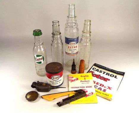 AUTOMOBILIA.
Four oil bottles, a tin of partly used ESSO grease, a Berkels oil can etc.