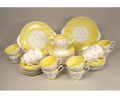 SHELLEY.
A Shelley, fine bone china part tea service for 12 (lacks sugar bowl), in the Butter Yellow 'Pole Star' pattern.
NOT