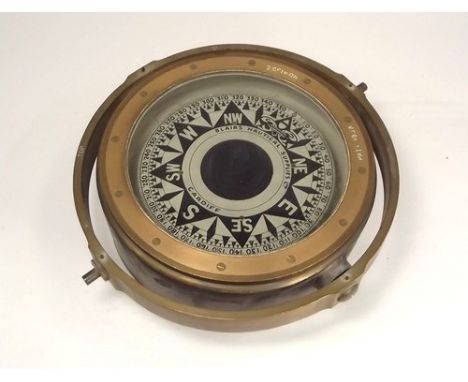 SHIP'S COMPASS.
A brass cased ship's compass, with gimbal mount & Ministry of Defence arrow mark. 
Full diameter 25cm.
NOTE: 