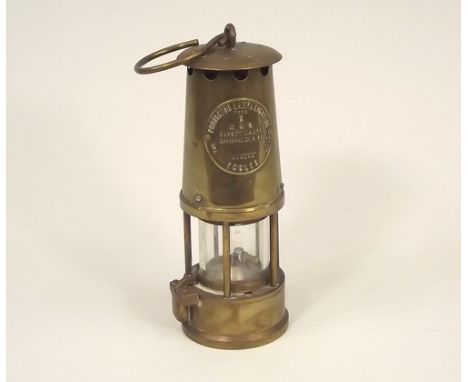MINER'S LAMP.
A brass miner's safety lamp by the Protector Lamp & Lighting Co., Eccles.
Height 22cm.