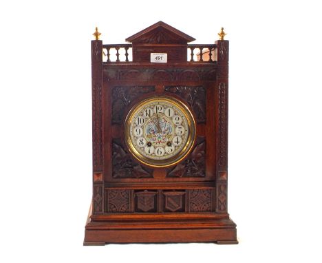A large oak Gothic style bracket clock with painted enamel dial