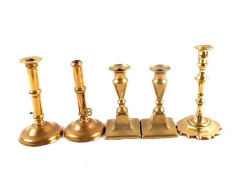 Two early 18th Century side ejector brass candlesticks, 18th Century petal base brass candlestick plus a pair of short Georgi