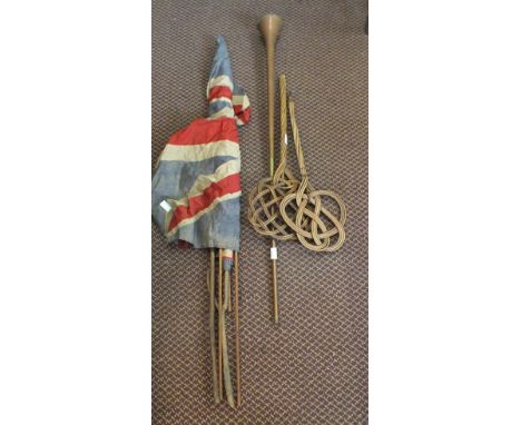 Two tapestry wall hangings, carpet beater, flags and a copper horn