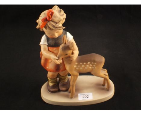 A large Hummel figurine, girl with fawn, height 11"