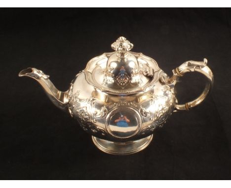 An embossed silver teapot, London 1863, makers Edward & John Barnard