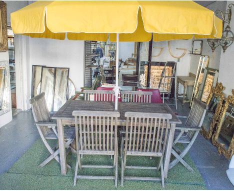 GARDEN TABLE, weathered teak, rectangular, 75cm H x 150cm W x 90cm D, a set of six folding armchairs and a yellow parasol. (7