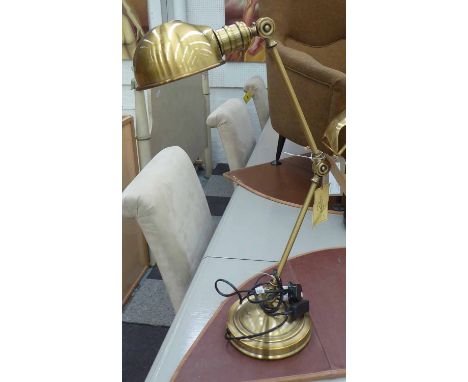 A RALPH LAUREN BANKER STYLE TABLE LAMP, an adjustable arm with a brass finish.