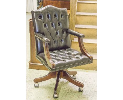 SWIVEL DESK CHAIR, buttoned black leather upholstered on castors, 56cm W.