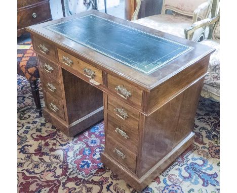 PEDESTAL DESK, late Victorian walnut with a rectangular green leather top above nine short drawers, 99cm W x 76cm H x 55cm D.