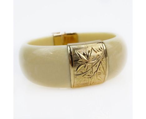 Vintage 14 Karat Yellow Gold Mounted Ivory Bangle Bracelet. Stamped 14K 585. Good condition. Measures 1" W, 2-3/8" interior d