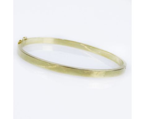 Vintage 14 Karat Yellow Gold Hinged Bangle Bracelet. Minor ding and surface wear from normal use. Measures 1/4" W, 2-7/16" in