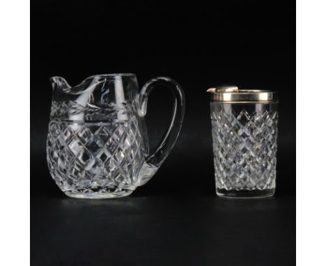 Two Cut Crystal Pitchers. A Waterford "Glandore" Ice Lip Pitcher and a Hawkes Crystal and Sterling Pourer. Both pieces signed