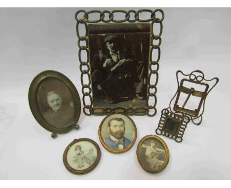 A hand painted portrait on ivory of bearded man together with others