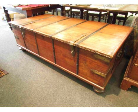 An Eastern hardwood large coffee table trunk with twin handles, 165cm x 82cm