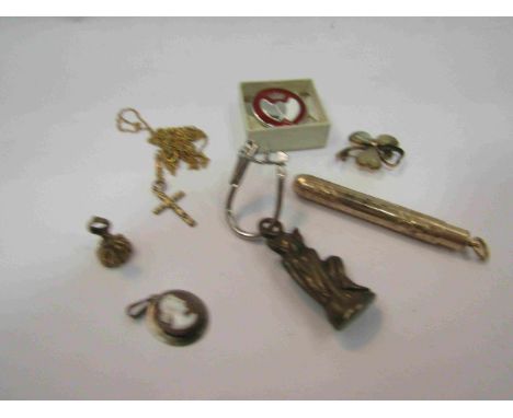 A propelling pencil, Pixie figure, necklace with cross and pendant   