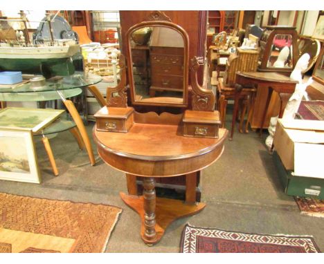 A bow front dressing table on turned front leg with two drawers, 135cm x 87cm x 41cm