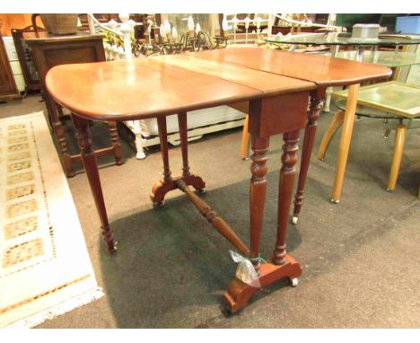 A pale mahogany Sutherland table on ceramic castors 