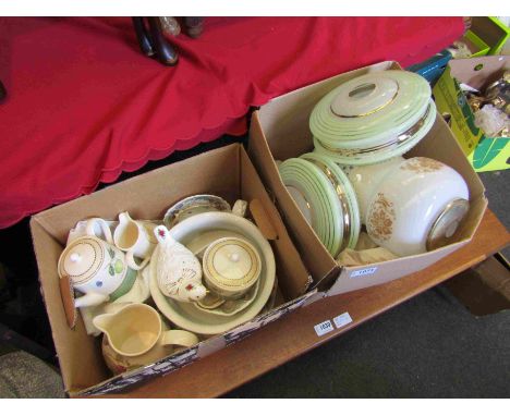 A box of light shades and dinnerware 