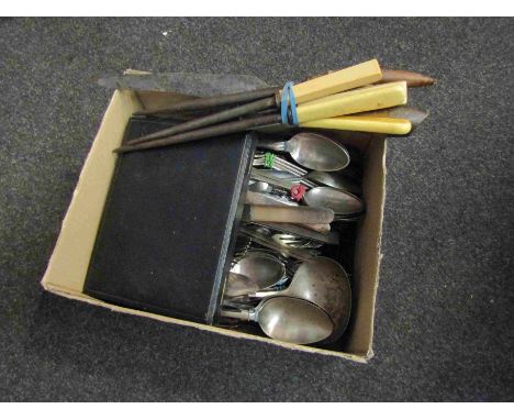 A collection of silver plated and base metal cutlery including dinner knives and ladle etc.