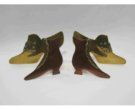 Two pairs of brass mantelpiece shoe ornaments 