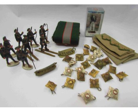 A small selection of military items including buttons epaulettes, belt and cast metal soldiers 