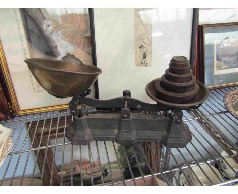 A set of brass kitchen scales and weights