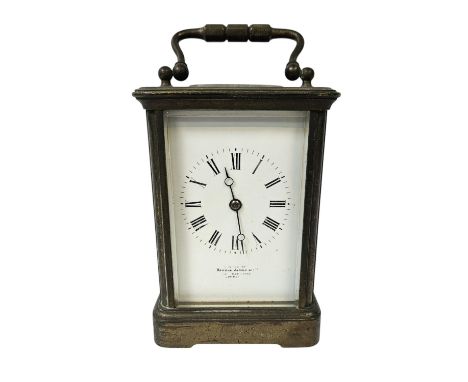 Howell James of London Brass Carriage clock with roman numeral dial, complete with key. 16cm in Height