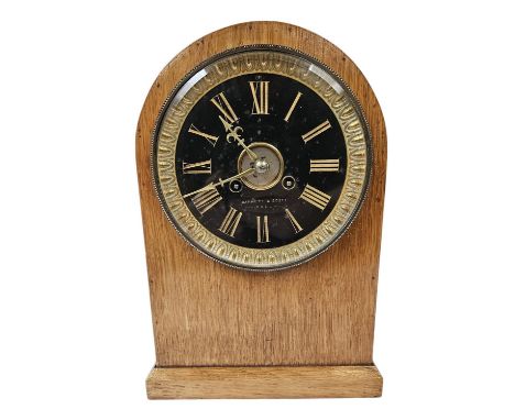 Barnett &amp; Scott of Hull Oak Cased mantel clock with gilded roman numeral dial and glass front. 31cm in Height 
