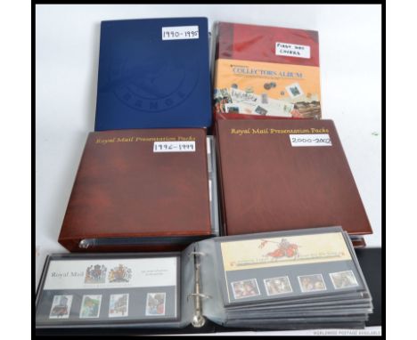 A large collection of presentation stamps dating from the 1980's having a face value of over £300 along with a folder of firs
