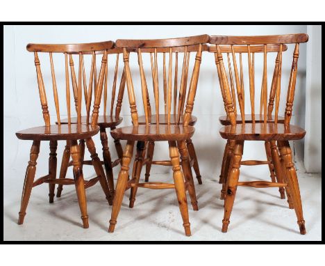 A set of 6 contemporary country pine stick back dining chairs Raised on turned legs united by stretchers having solid panel s