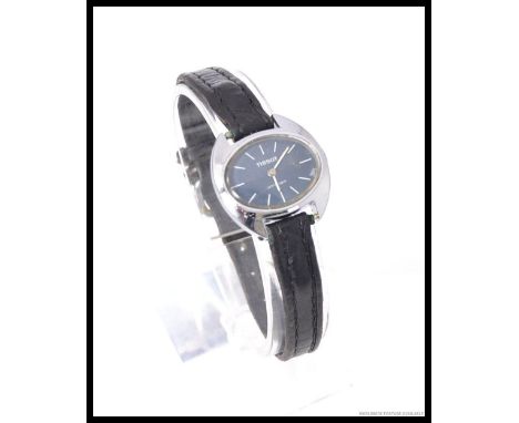 An original 1970's ladies Tissot Stylist dress watch. Set on leather strap with black face and steel case. Complete in box wi