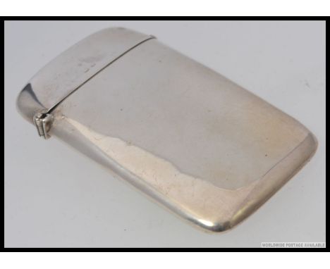 A good quality silver hallmarked cigarette case being bow shaped for the pocket with hinged lid by William Henry Sparrow- H W