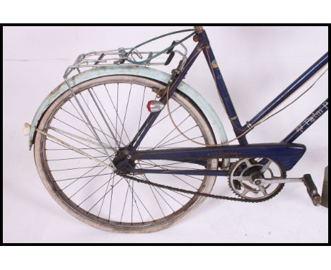 A vintage 1960's ladies Triumph Palm Beech bicycle with original paintwork, saddle etc.