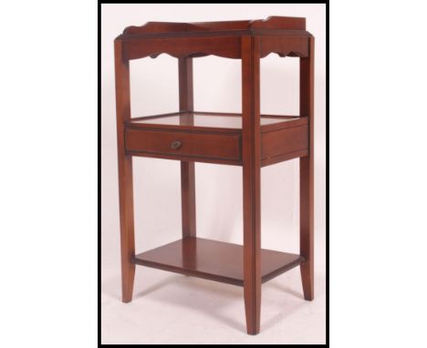 A good quality Georgian style mahogany side table / lamp table. Raised on squared legs with central drawer and open shelf. H8