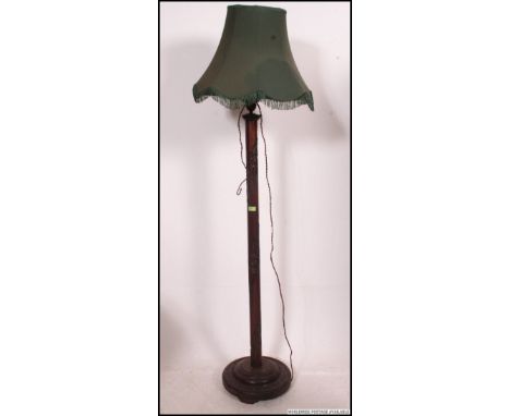 Early to mid 20th century carved hardwood Chinese standard lamp complete with a decorative tassled shade