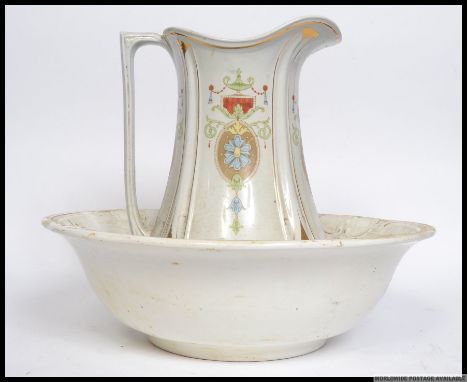 An early 20th century Art Nouveau ceramic washbowl and water jug by JG Meakin being stamped to the base 35cm high