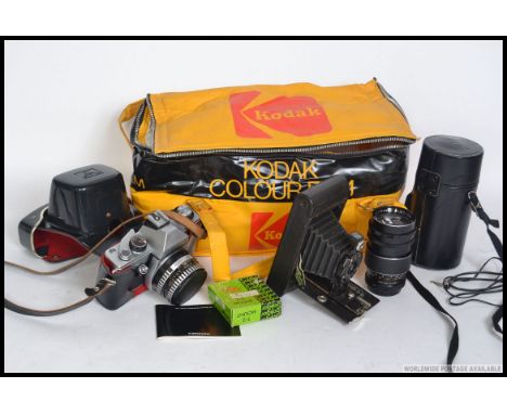 A collection of vintage cameras to include 35mm such as Praktica, Kodak etc along with lenses please see images
