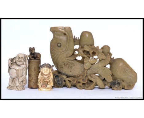 A collection of Chinese items to include Netsuke, soapstone carved seal with character marks to the base along with a soapsto