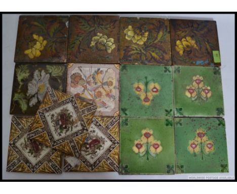 A collection of late 19th and early 20th century fireside ceramic tiles, thirteen in total with different makers. H15.5 x W15