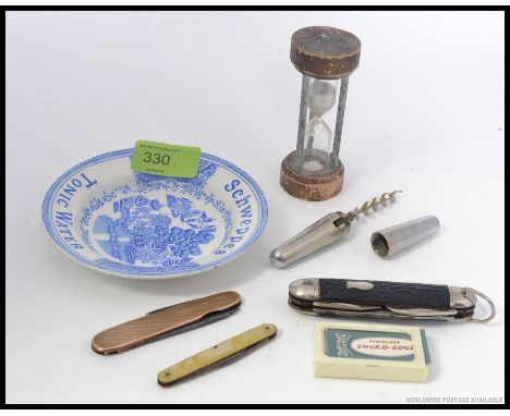 A collection of vintage pen knives together with corkscrew, old egg timer, Schweppes saucer blue and white etc. L13cm 
 